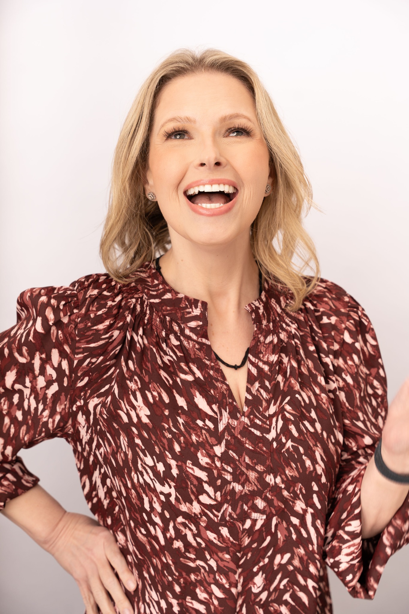 Crystal Rowell laughing and looking upward